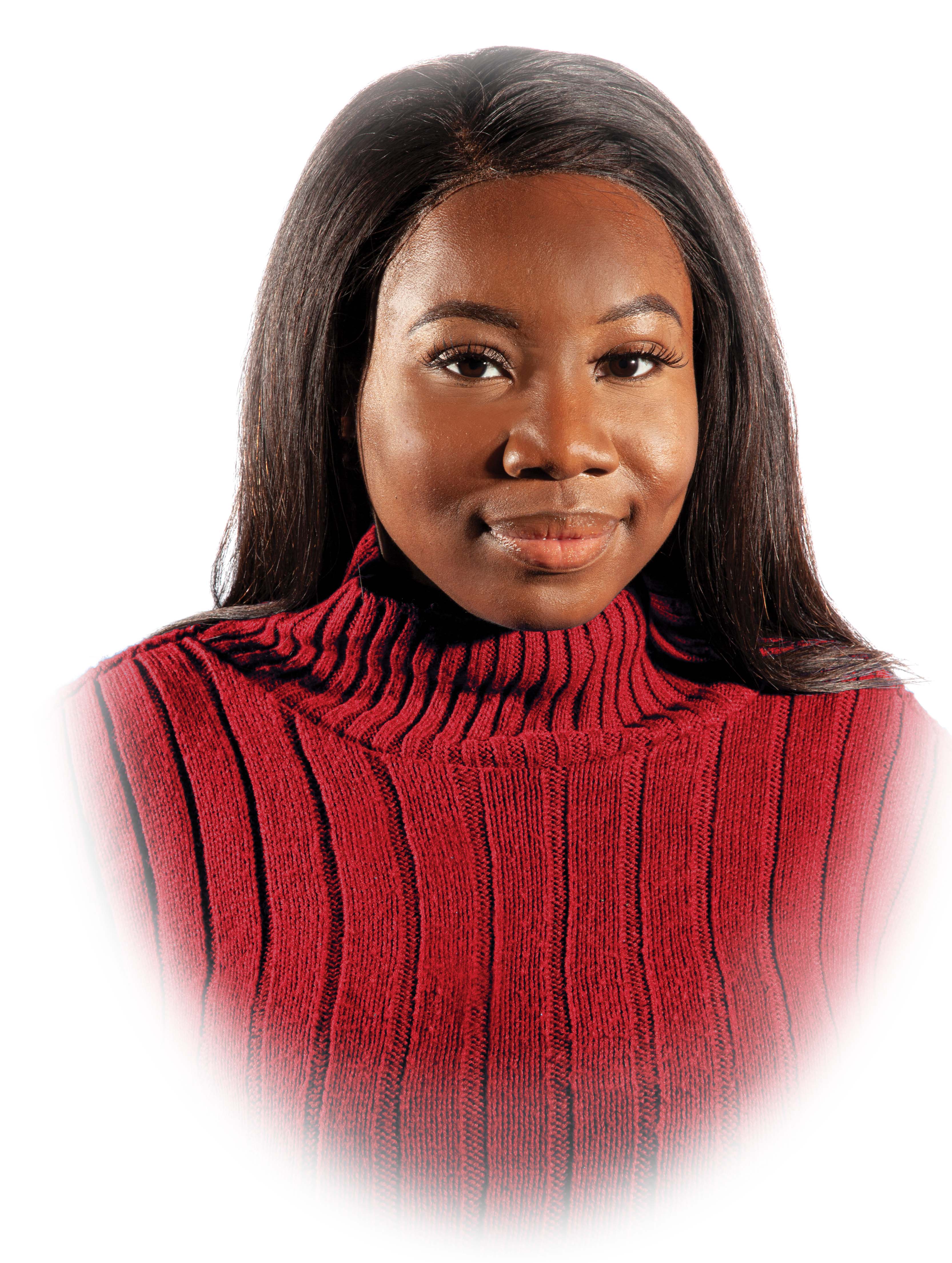 Oge Obioba, a black women with logn black hair, wearing a red turtleneck