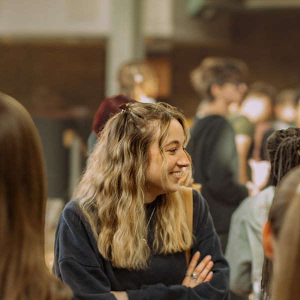 Photo of student smiling to something off camera