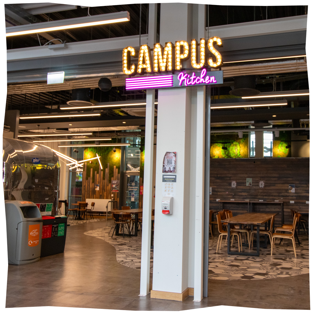 Campus Kitchen, with food outlets and big tables and chairs